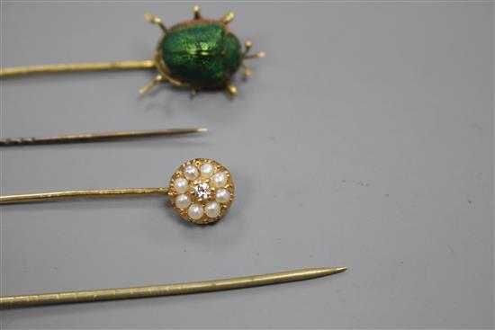 A yellow metal and scarab set stick, three others including Essex crystal style, pearl and pearl and diamond, largest 82mm.